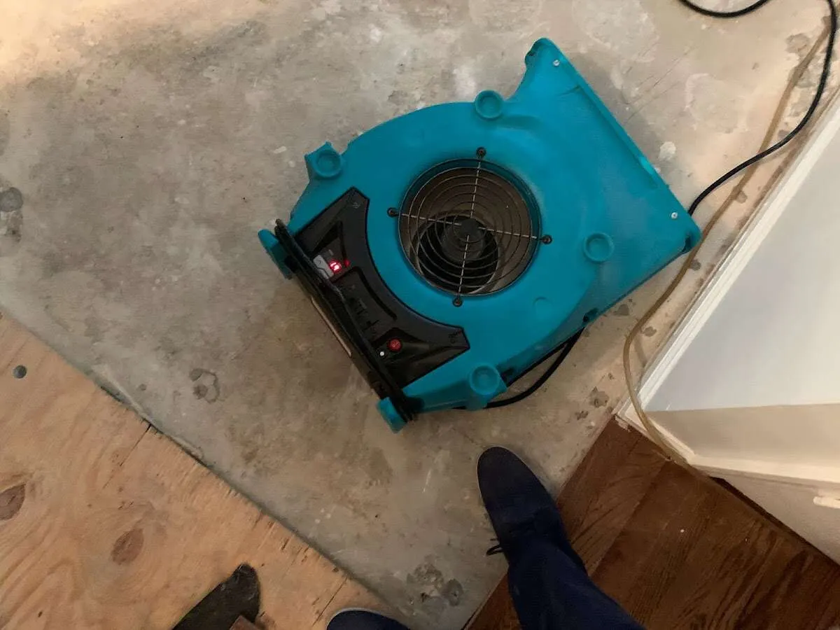 Air mover drying subfloor during Commercial Water Damage Restoration in Citrus Springs